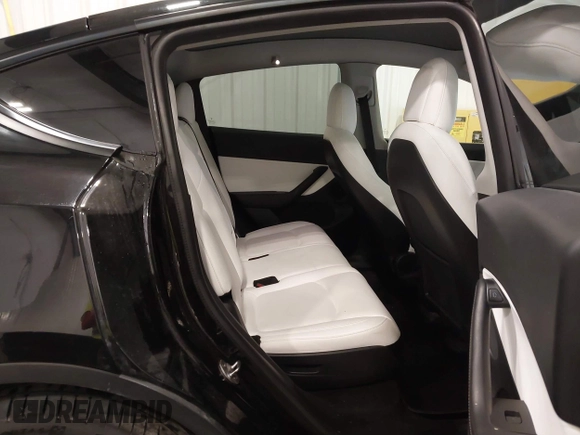 2021 Tesla Model Y Long Range with VIN 5YJYGAEE5MF305655, listed as a IAAI auction lot 41860993 with 50,750 mi miles. Bid and sale history available at carsss.com. Image 8.
