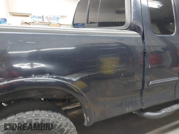 1999 Ford F-150 XL with VIN 1FTRX18L5XKB05347, listed as a IAAI auction lot 41885737 with 250,070 mi miles. Bid and sale history available at carsss.com. Image 6.