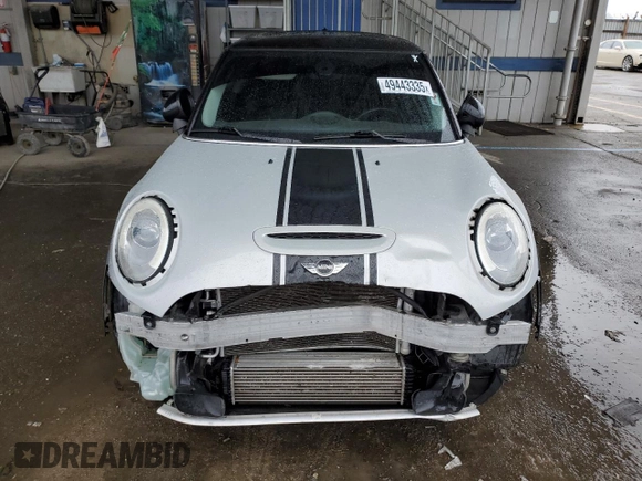 2014 MINI Hardtop S with VIN WMWXM7C57ET985421, listed as a Copart auction lot 49443335 with 76,168 mi miles and Salvage Title. Bid and sale history available at DreamBid. Image 5.