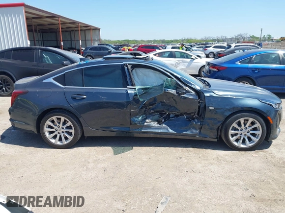 2021 Cadillac CT5 Luxury z VIN 1G6DW5RKXM0144424, wystawiony jako IAAI lot #41985803 z przebiegiem 65 555 mil mil oraz . Historia ofert i sprzedaży dostępna na DreamBid. Obrazek 13.