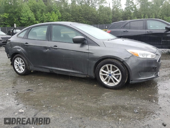2018 Ford Focus SE z VIN 1FADP3F21JL285417, wystawiony jako Copart lot #56936965 z przebiegiem Nie podano mil oraz Czysty tytuł • Clean title. Historia ofert i sprzedaży dostępna na DreamBid. Obrazek 4.