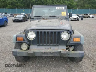 1998 Jeep Wrangler Sport z VIN 1J4FY19S7WP801709, wystawiony jako Copart lot #64495985 z przebiegiem 260 798 mil mil oraz Czysty tytuł • Clean title. Historia ofert i sprzedaży dostępna na DreamBid. Obrazek 5.