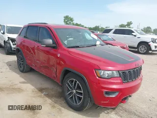 2018 Jeep Grand Cherokee Trailhawk with VIN 1C4RJFLG3JC277015, listed as a IAAI auction lot 42245753 with 70,671 mi miles and . Bid and sale history available at DreamBid. Image 1.