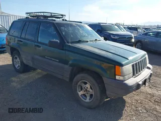1998 Jeep Grand Cherokee Laredo with VIN 1J4GZ58S5WC362365, listed as a IAAI auction lot 41891397 with 246,673 mi miles. Bid and sale history available at carsss.com. Image 1.