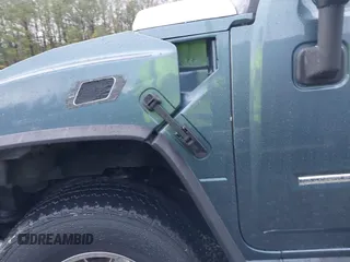 2005 Hummer H2 SUT with VIN 5GRGN22U15H114401, listed as a IAAI auction lot 41268764 with 166,651 mi miles. Bid and sale history available at carsss.com. Image 6.