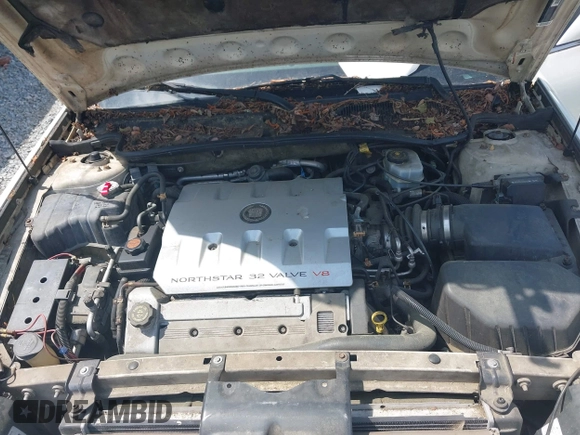 2000 Cadillac DeVille DTS z VIN 1G6KF5792YU216318, wystawiony jako IAAI lot #42134531 z przebiegiem 167 518 mil mil oraz . Historia ofert i sprzedaży dostępna na DreamBid. Obrazek 10.