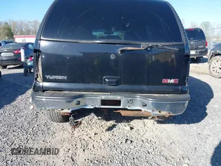 2004 GMC Yukon SLT with VIN 1GKEK13Z34R136256, listed as a IAAI auction lot 42122862 with 263,607 mi miles. Bid and sale history available at carsss.com. Image 6.