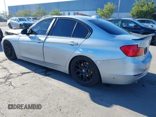 2015 BMW 3 Series 328i with VIN WBA3A5C57FF609054, listed as a IAAI auction lot 41330498 with 129,378 mi miles. Bid and sale history available at carsss.com. Image 3.