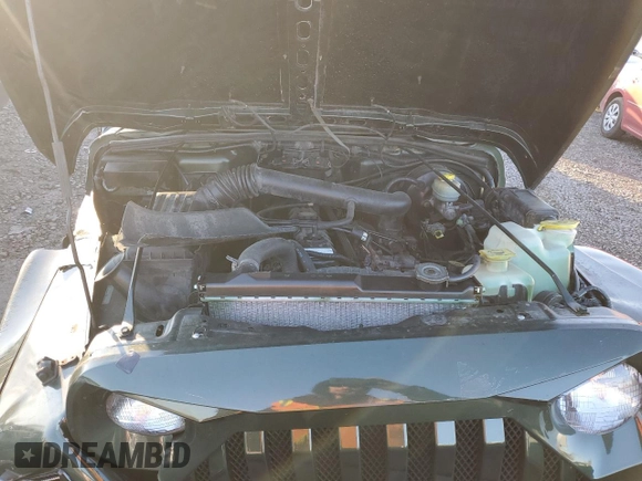 1998 Jeep Wrangler Sahara z VIN 1J4FY49S5WP798505, wystawiony jako Copart lot #88394465 z przebiegiem Nie podano mil oraz Szkoda całkowita • Salvage title. Historia ofert i sprzedaży dostępna na DreamBid. Obrazek 11.