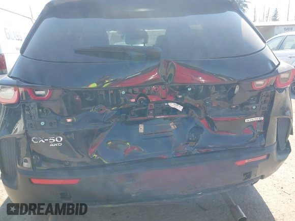 2025 Mazda CX-50 S Preferred with VIN 7MMVABBM9SN301063, listed as a IAAI auction lot 42801040 with 23,696 mi miles and . Bid and sale history available at DreamBid. Image 6.