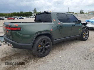 2023 Rivian R1T Adventure z VIN 7FCTGAAA8PN001040, wystawiony jako Copart lot #71517874 z przebiegiem 19 789 mil mil oraz Szkody całkowita. Historia ofert i sprzedaży dostępna na DreamBid. Obrazek 3.
