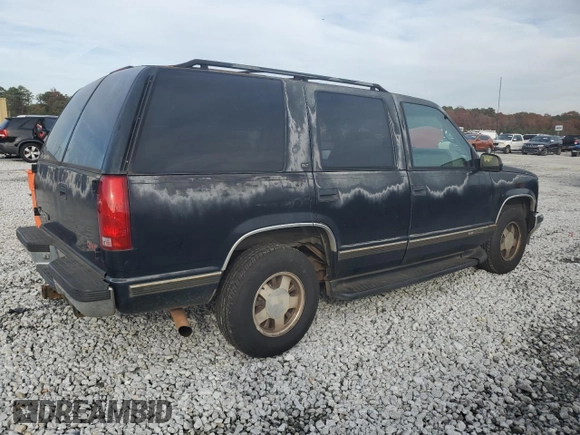1999 GMC Yukon with VIN 1GKEC13R7XJ802387, listed as a Copart auction lot 82819934 with 438,574 mi miles and Salvage Title. Bid and sale history available at carsss.com. Image 3.