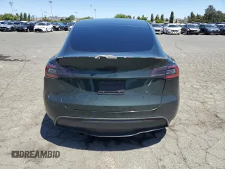 2022 Tesla Model Y Performance z VIN 7SAYGDEF2NF573979, wystawiony jako Copart lot #57778265 z przebiegiem 49 232 mil mil oraz Szkoda całkowita • Salvage title. Historia ofert i sprzedaży dostępna na DreamBid. Obrazek 6.