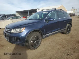 2014 Volkswagen Touareg Sport with VIN WVGEF9BP9ED005759, listed as a Copart auction lot 43617445 with 97,208 mi miles and Salvage Title. Bid and sale history available at DreamBid. Image 1.