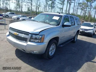 2013 Chevrolet Suburban LT with VIN 1GNSKJE71DR213143, listed as a IAAI auction lot 41585336 with 103,635 mi miles. Bid and sale history available at carsss.com. Image 2.