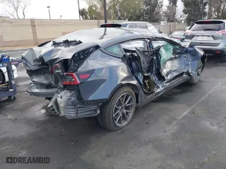 2023 Tesla Model 3 with VIN 5YJ3E1EA6PF408858, listed as a IAAI auction lot 41739383 with 1 mi miles. Bid and sale history available at carsss.com. Image 4.