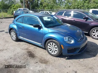 2018 Volkswagen Beetle S with VIN 3VWFD7AT9JM712664, listed as a IAAI auction lot 41634663 with 72,649 mi miles. Bid and sale history available at carsss.com. Image 1.