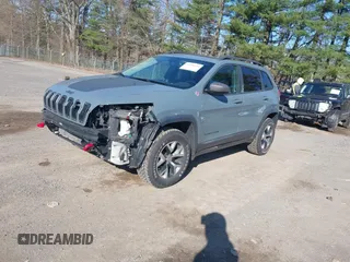 2014 Jeep Cherokee Trailhawk with VIN 1C4PJMBS4EW179763, listed as a IAAI auction lot 41988048 with 152,681 mi miles. Bid and sale history available at carsss.com. Image 2.