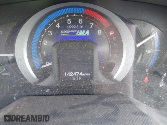 2010 Honda Insight EX with VIN JHMZE2H71AS017996, listed as a IAAI auction lot 42091356 with 142,474 mi miles and . Bid and sale history available at DreamBid. Image 15.
