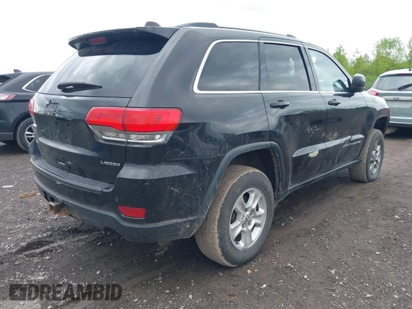 2016 Jeep Grand Cherokee Laredo with VIN 1C4RJFAG2GC436005, listed as a IAAI auction lot 42377859 with 129,724 mi miles and . Bid and sale history available at DreamBid. Image 4.