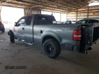 2005 Ford F-150 STX with VIN 1FTRX12W25NA37703, listed as a Copart auction lot 60089325 with 128,651 mi miles and Salvage title. Bid and sale history available at DreamBid. Image 2.