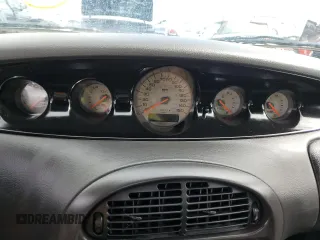 1999 Plymouth Prowler z VIN 1P3EW65G7XV503356, wystawiony jako Copart lot #74829624 z przebiegiem Nie podano mil oraz Nie do naprawy. Historia ofert i sprzedaży dostępna na DreamBid. Obrazek 9.