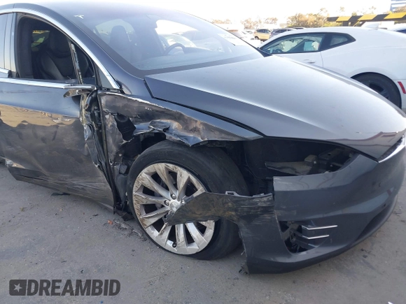 2018 Tesla Model X 75D with VIN 5YJXCDE28JF142509, listed as a IAAI auction lot 41993444 with 100,244 mi miles and . Bid and sale history available at carsss.com. Image 6.