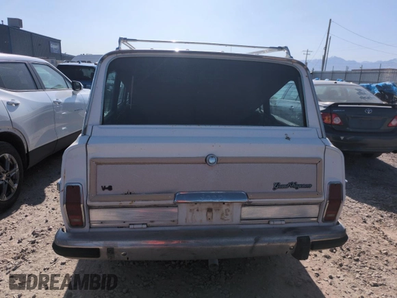 1987 Jeep Grand Wagoneer с VIN 1JCNJ15UXHT013691, выставлен на аукционе Copart как лот 59439595 с пробегом 174 941 миль миль и Чистый • Clean title. История ставок и продаж доступна на DreamBid. Изображение 6.