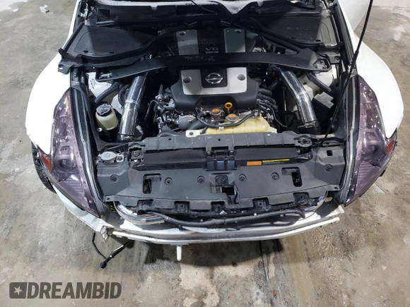 2012 Nissan 370Z z VIN JN1AZ4EH2CM564443, wystawiony jako Copart lot #45126885 z przebiegiem 71 729 mil mil oraz Szkody całkowita. Historia ofert i sprzedaży dostępna na DreamBid. Obrazek 12.
