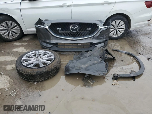 2021 Mazda CX-5 Grand Touring with VIN JM3KFBDM9M0452011, listed as a Copart auction lot 46230945 with 54,825 mi miles and Salvage Title. Bid and sale history available at carsss.com. Image 13.