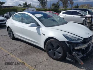 2018 Tesla Model 3 Long Range Battery with VIN 5YJ3E1EA8JF162130, listed as a IAAI auction lot 41933015 with 50,081 mi miles. Bid and sale history available at carsss.com. Image 1.