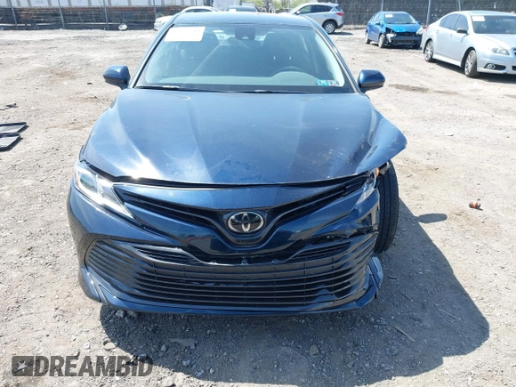 2019 Toyota Camry LE with VIN 4T1B11HK6KU276644, listed as a IAAI auction lot 42037249 with 23,677 mi miles and . Bid and sale history available at DreamBid. Image 12.