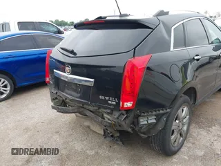 2016 Cadillac SRX Luxury Collection z VIN 3GYFNBE32GS577023, wystawiony jako IAAI lot #42374130 z przebiegiem 132 671 mil mil oraz . Historia ofert i sprzedaży dostępna na DreamBid. Obrazek 6.