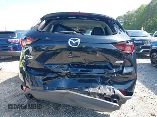 2017 Mazda CX-5 Touring z VIN JM3KFBCL0H0209458, wystawiony jako IAAI lot #42169599 z przebiegiem 93 287 mil mil oraz . Historia ofert i sprzedaży dostępna na DreamBid. Obrazek 6.
