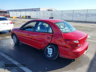 2002 Kia Rio with VIN KNADC123526160314, listed as a IAAI auction lot 41527989 with 124,252 mi miles. Bid and sale history available at carsss.com. Image 3.