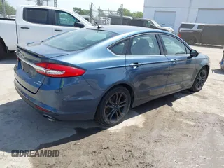 2018 Ford Fusion Hybrid SE with VIN 3FA6P0LU9JR137983, listed as a IAAI auction lot 42087894 with 196,330 mi miles. Bid and sale history available at carsss.com. Image 4.