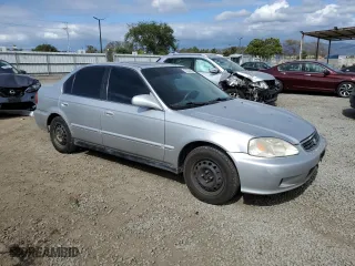1999 Honda Civic EX with VIN 1HGEJ8649XL023265, listed as a Copart auction lot 53534445 with 265,017 mi miles and Clean Title. Bid and sale history available at carsss.com. Image 4.