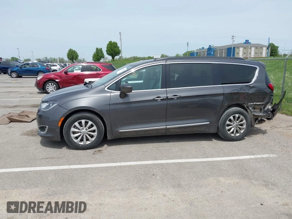 2017 Chrysler Pacifica Touring L with VIN 2C4RC1BG1HR540246, listed as a IAAI auction lot 42107768 with 151,268 mi miles and . Bid and sale history available at DreamBid. Image 14.