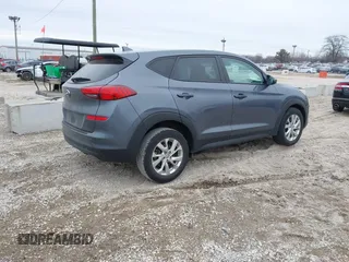 2021 Hyundai Tucson SE with VIN KM8J23A40MU299596, listed as a IAAI auction lot 41513198 with 54,284 mi miles and . Bid and sale history available at DreamBid. Image 4.
