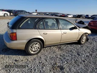 1999 Saturn SW z VIN 1G8ZK8277XZ162136, wystawiony jako Copart lot #83206604 z przebiegiem Nie podano mil oraz Szkody całkowita. Historia ofert i sprzedaży dostępna na DreamBid. Obrazek 3.
