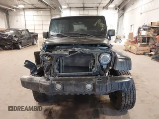 2017 Jeep Wrangler Unlimited Sport with VIN 1C4BJWDGXHL698014, listed as a IAAI auction lot 41384325 with 121,402 mi miles. Bid and sale history available at carsss.com. Image 13.