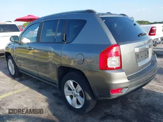 2011 Jeep Compass with VIN 1J4NT1FA4BD213994, listed as a IAAI auction lot 42020375 with 84,409 mi miles. Bid and sale history available at carsss.com. Image 3.