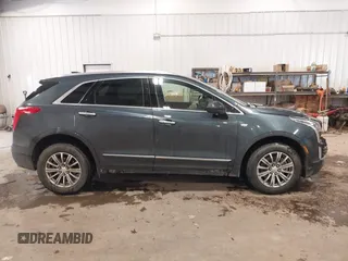 2019 Cadillac XT5 Luxury AWD z VIN 1GYKNDRS0KZ213092, wystawiony jako IAAI lot #41510497 z przebiegiem 26 030 mil mil oraz . Historia ofert i sprzedaży dostępna na DreamBid. Obrazek 13.