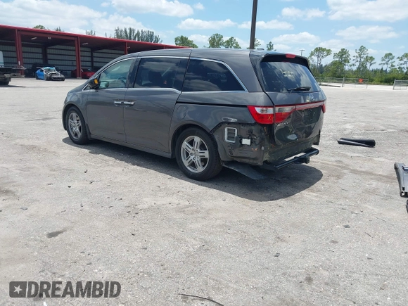 2013 Honda Odyssey Touring with VIN 5FNRL5H96DB068843, listed as a IAAI auction lot 42312176 with 115,804 mi miles and . Bid and sale history available at DreamBid. Image 3.