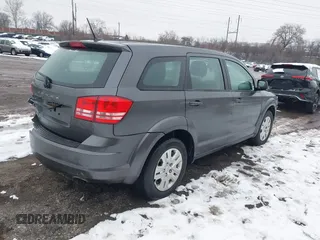 2014 Dodge Journey SE with VIN 3C4PDCAB0ET182376, listed as a IAAI auction lot 41569006 with 106,024 mi miles and . Bid and sale history available at DreamBid. Image 4.