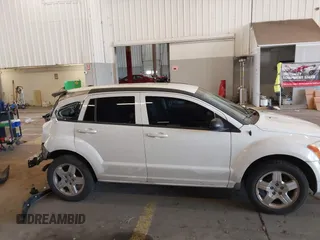 2009 Dodge Caliber SXT with VIN 1B3HB48A89D116734, listed as a IAAI auction lot 41959281 with 209,136 mi miles and . Bid and sale history available at DreamBid. Image 14.