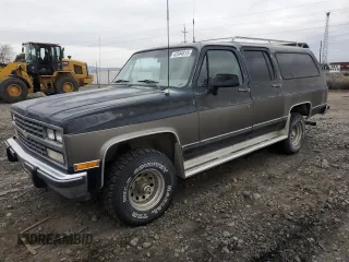 1991 Chevrolet Suburban z VIN 1GNEV16K2MF151633, wystawiony jako Copart lot #43584815 z przebiegiem 147 592 mil mil oraz Czysty tytuł • Clean title. Historia ofert i sprzedaży dostępna na DreamBid. Obrazek 1.