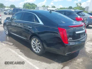 2013 Cadillac XTS Luxury z VIN 2G61P5S37D9101989, wystawiony jako IAAI lot #42242641 z przebiegiem 243 006 mil mil oraz . Historia ofert i sprzedaży dostępna na DreamBid. Obrazek 3.