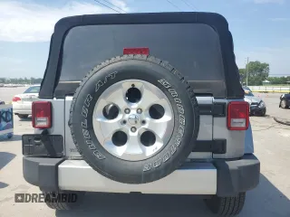 2015 Jeep Wrangler Sahara with VIN 1C4AJWBG1FL705900, listed as a Copart auction lot 62353275 with 64,866 mi miles and Salvage title. Bid and sale history available at DreamBid. Image 6.
