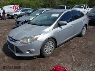 2012 Ford Focus SE with VIN 1FAHP3F22CL115877, listed as a IAAI auction lot 42031223 with 138,743 mi miles. Bid and sale history available at carsss.com. Image 2.